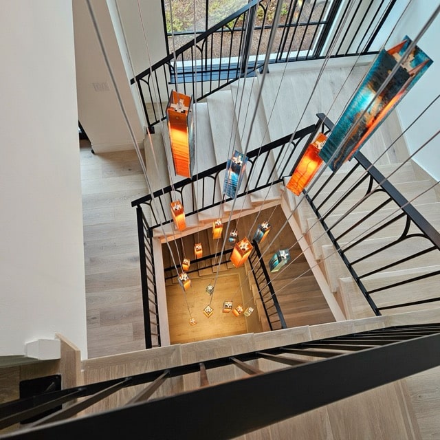 Custom Murano glass chandelier combining warm amber and champagne tones