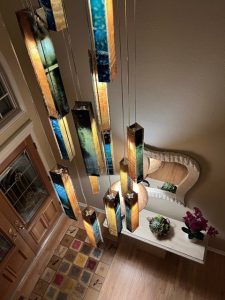 Bespoke SunBeam chandelier – dramatic lighting for extra-tall foyers