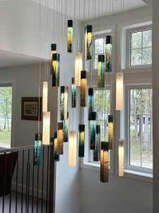 Luxury cascading SunBeam chandelier – bespoke design for high-ceiling entrances