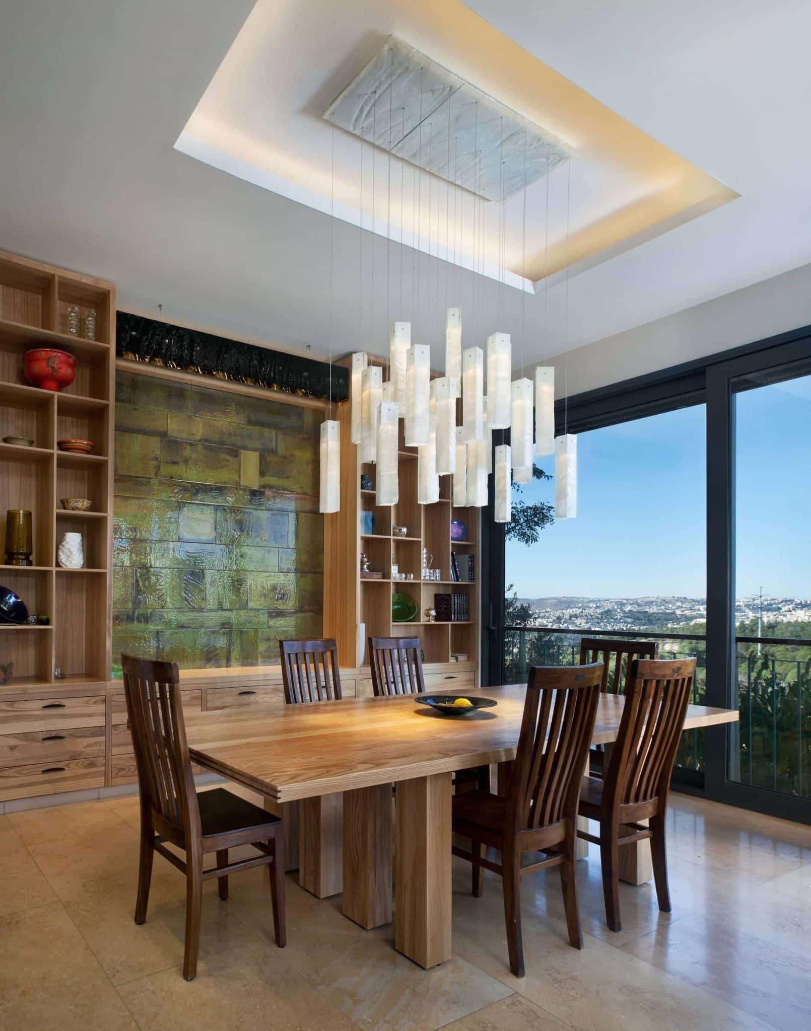 White Murano glass chandelier installation for dining space