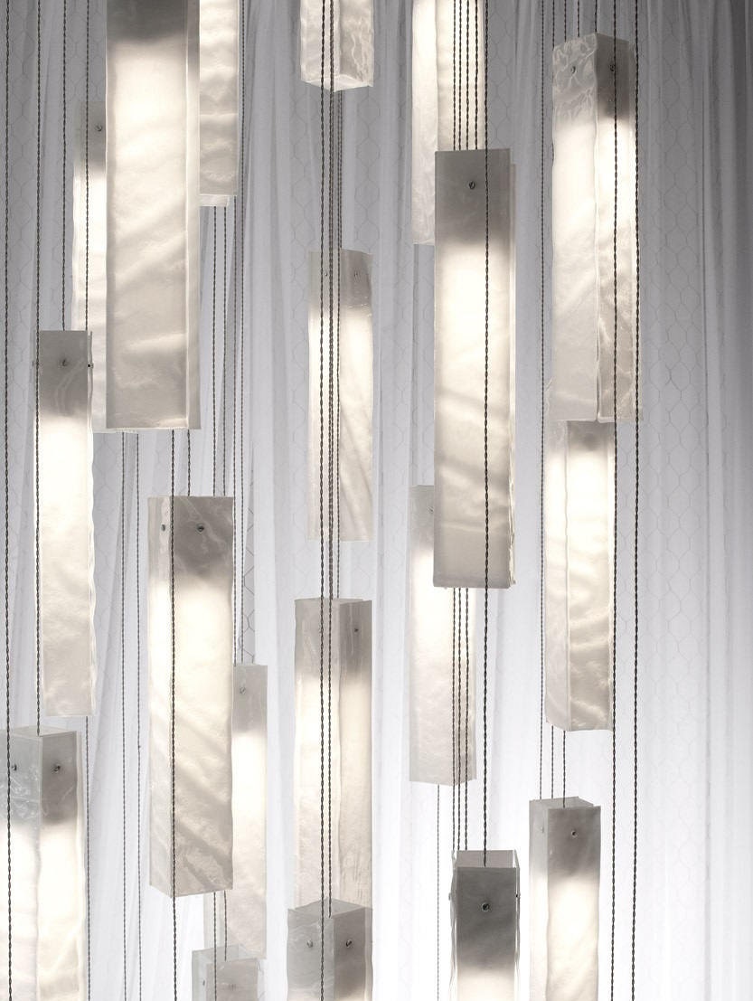 Elegant SunBeam art glass chandelier in double-height foyer crafted in multi-color glass