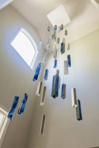 Sculptural SunBeam chandelier – custom lighting for large-scale lobbies