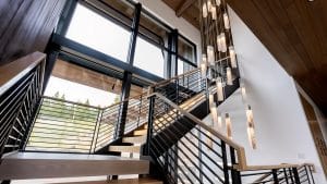 SunBeam pendant lights cascading dramatically above staircase void