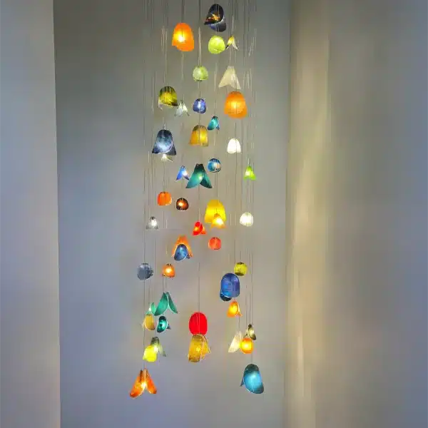 Custom Bivalvia chandelier installation with colorful glass pendants