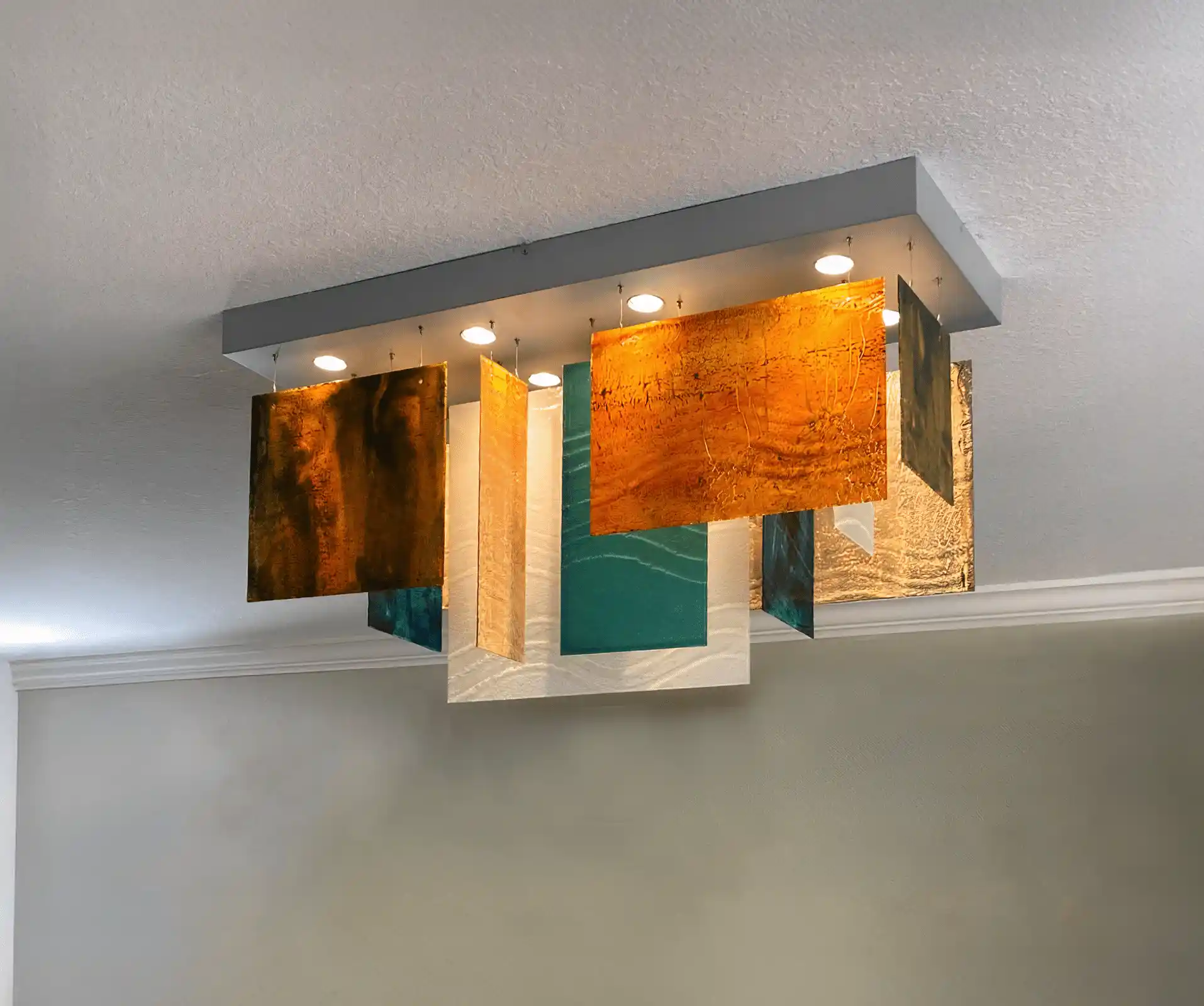 Cliffs pendant chandelier with sunset-inspired amber and coral tones